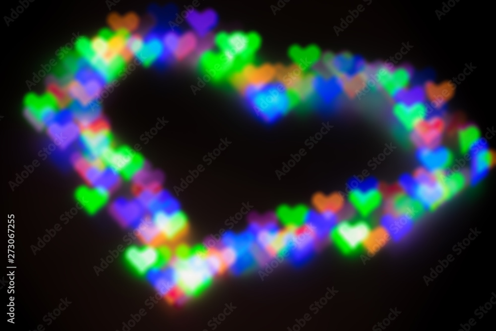 Blurred festive background with defocused colourful glitter formed a heart, bokeh in a shape of a heart. Original photographic effect. Pictures concept theme Love and St. Valentine's Day Blurred festive background with defocused colourful glitter formed a heart, bokeh in a shape of a heart. Original photographic effect. Pictures concept theme Love and St. Valentine's Day