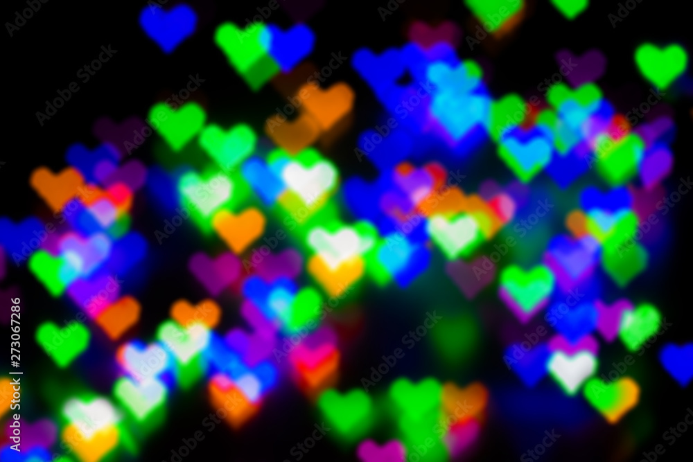 Blurred festive background with defocused colourful glitter formed a heart, bokeh in a shape of a heart. Original photographic effect. Pictures concept theme Love and St. Valentine's Day Blurred festive background with defocused colourful glitter formed a heart, bokeh in a shape of a heart. Original photographic effect. Pictures concept theme Love and St. Valentine's Day