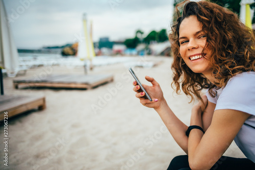 Happy young woman smiling looking at camera