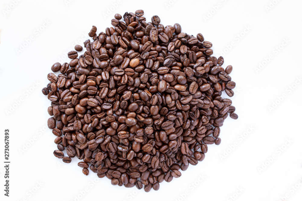 Pile of coffee beans on white background. Top view. Close up image. Pile of coffee beans on white background. Top view. Close up image.