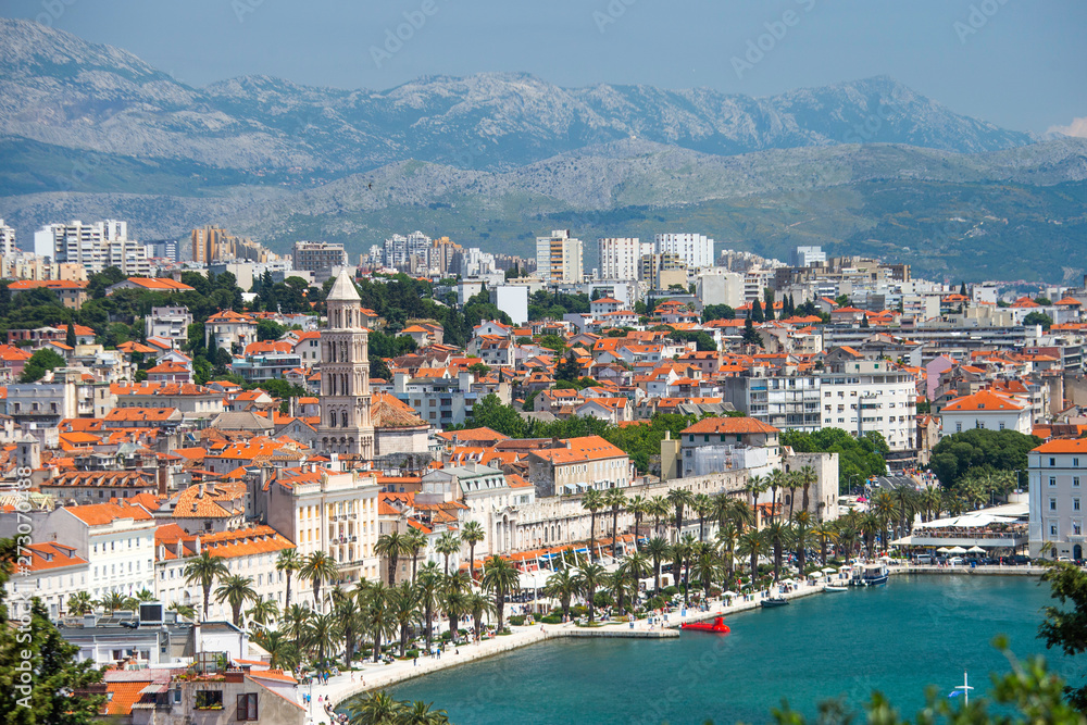 Old town of Split in Dalmatia, Croatia. Panoramic view of city center, palace of Roman emperor Diocletianus and cathedral. Popular tourist destination in Europe.