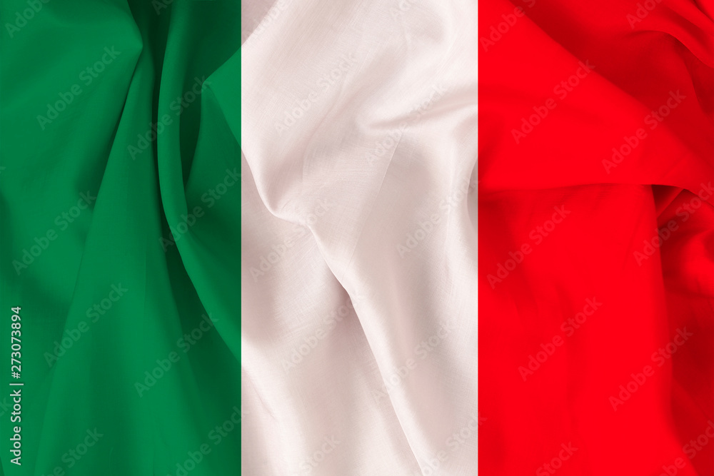 beautiful national flag of Italy on soft silk with soft folds, close-up, copy space