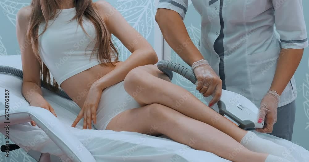 Feet girl on a white background. The concept of beauty and body care. ELOS hair removal. Laser hair removal. Photoepilation.