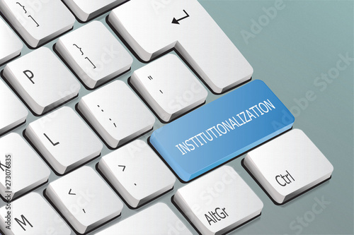 institutionalization written on the keyboard button photo
