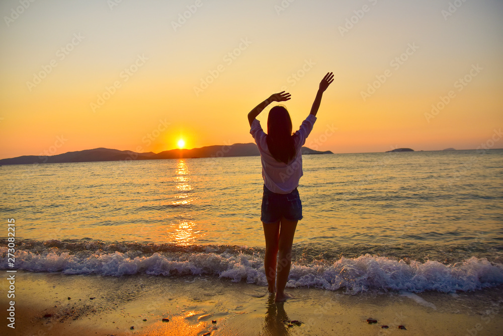 Women Standing on  Beach at Sea And Sunset Background  Summer Holidays