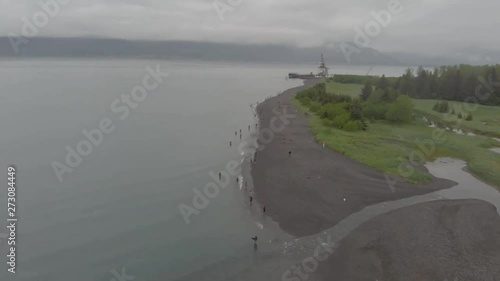 Alaskans line the beach to subsistence fish for salmon