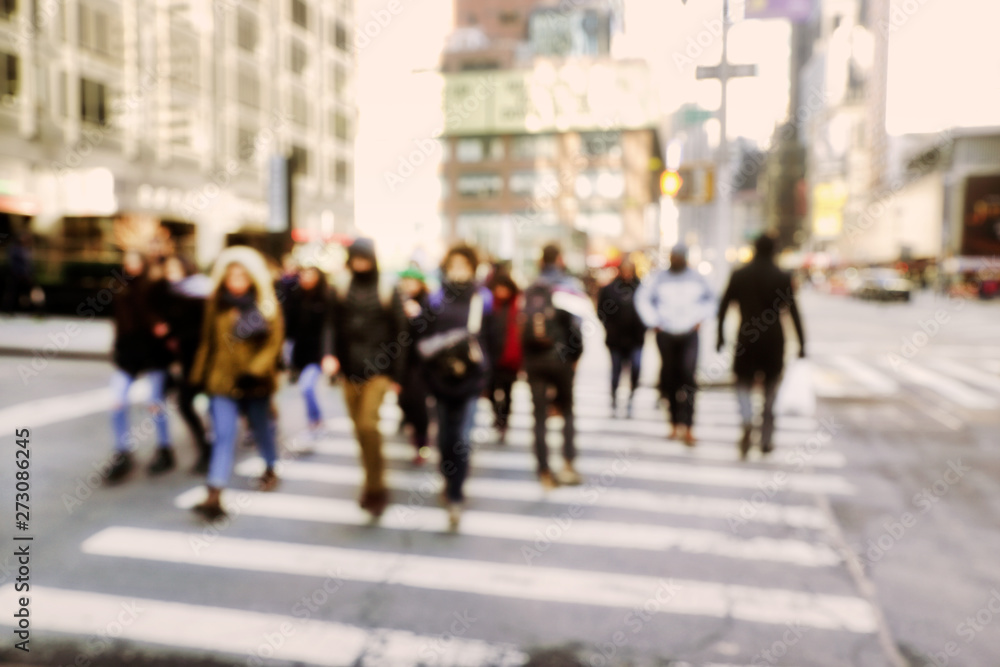 Blurry abstract background image of people walking on busy street Blurry abstract background image of people walking on busy street