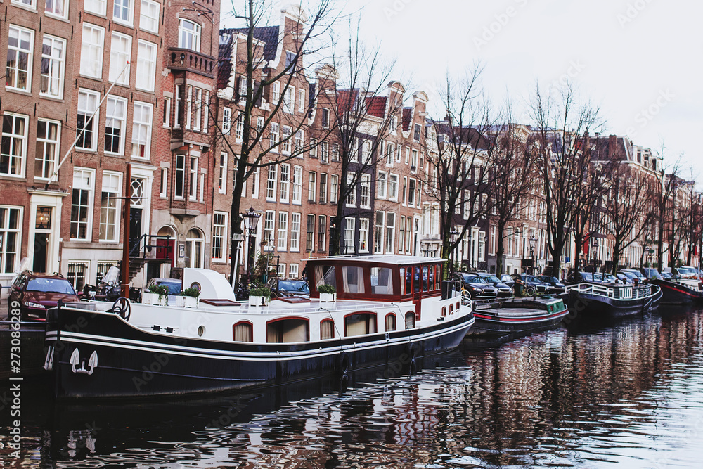 Channel in Amsterdam Netherlands Boat houses river european city landscape