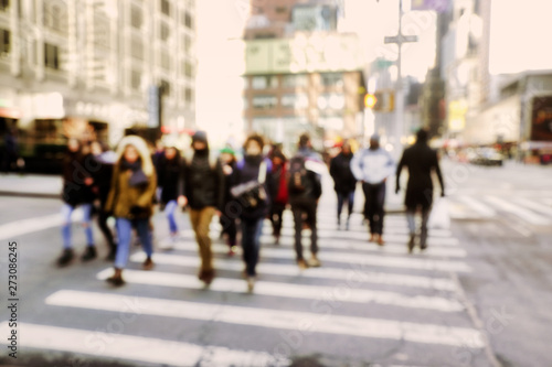 Blurry abstract background image of people walking on busy street