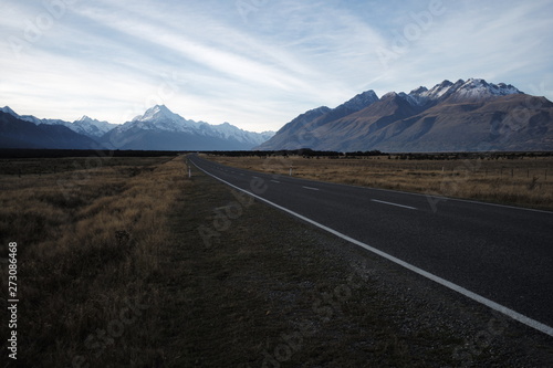local road and mountain background with blue sky