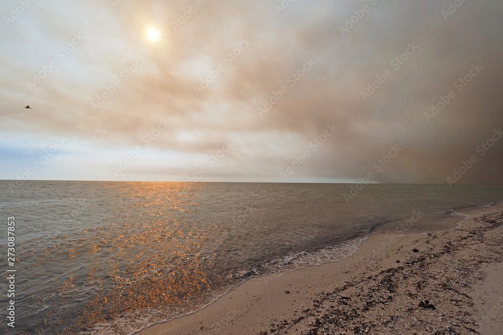 Smoke from a wildfire over the beach and Gulf of Mexico on East Cape Sable in Everglades National Park, Florida. Smoke from a wildfire over the beach and Gulf of Mexico on East Cape Sable in Everglades National Park, Florida.