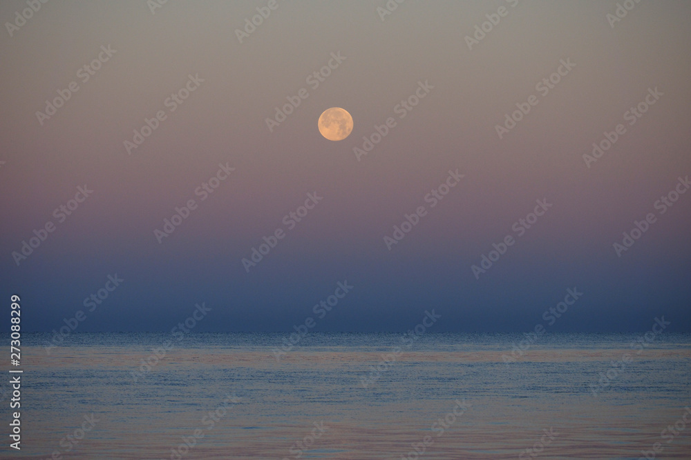 The setting moon over the Gulf of Mexico off East Cape Sable in Everglades National Park, Florida.