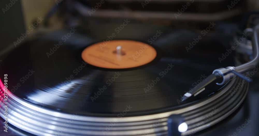 Slow Motion Close Up Panning Shot Of Vinyl Record Spinning On Record Player Slow Motion Close Up Panning Shot Of Vinyl Record Spinning On Record Player