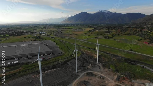 Windmill Farm wind park wind turbines Sunset Colors Farmland Field Wasatch Mountain Range Blue Skys Agriculture Farming Spanish Fork Utah Renewable Energy Cinematic Video USA 4K photo