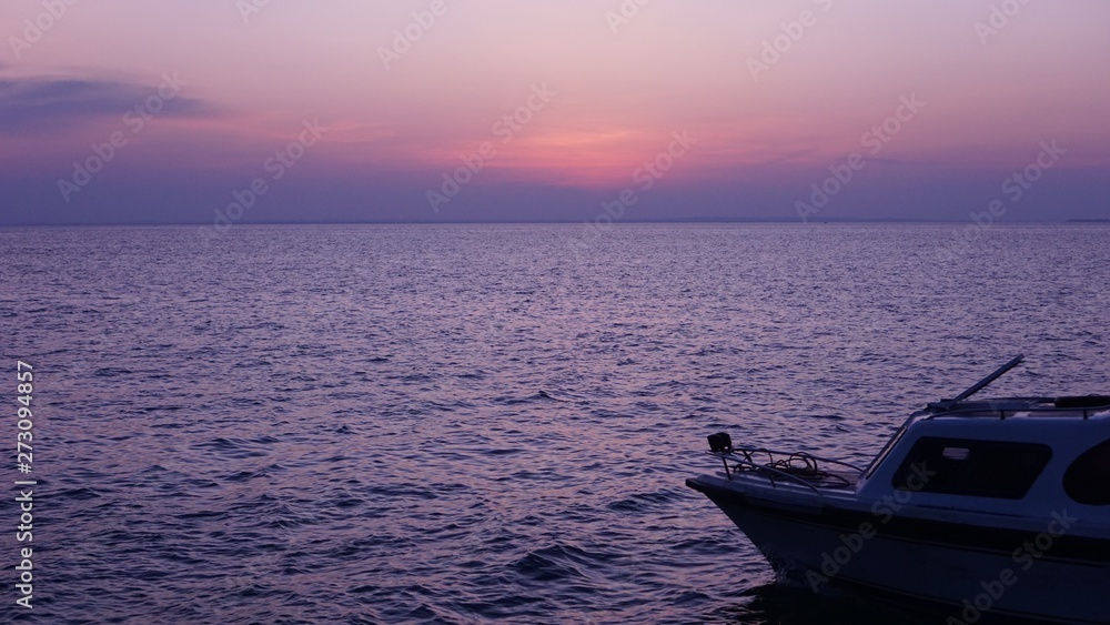 Boat on the beach at sunset in the afternoon