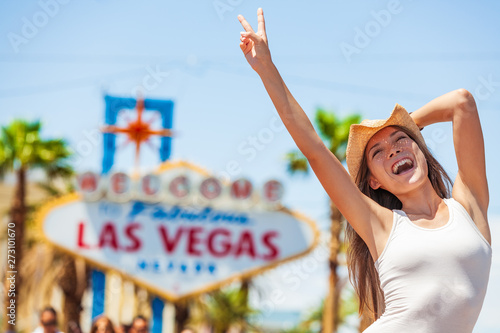 Las Vegas sign USA vacation fun american tourist cowgirl woman on road trip travel screaming of joy with cowboy hat on The Strip. Welcome to Fabulous Las Vegas, Nevada, Summer adventure.