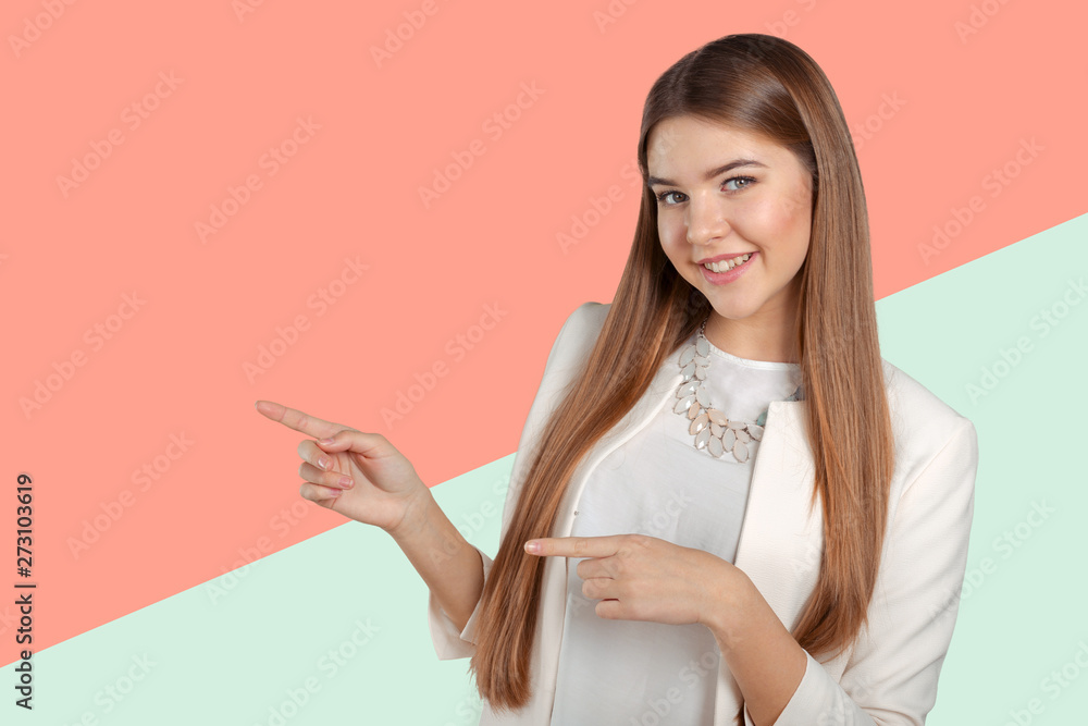 Young elegant woman pointing