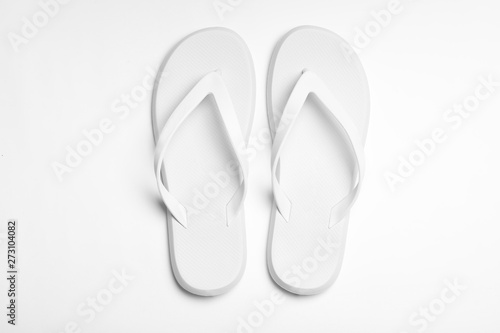 Pair of flip flops on white background, top view. Beach accessories