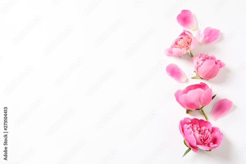 Beautiful peony flowers on white background, top view Beautiful peony flowers on white background, top view