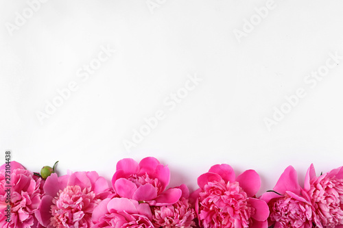 Fototapeta Naklejka Na Ścianę i Meble -  Beautiful peony flowers on white background, top view