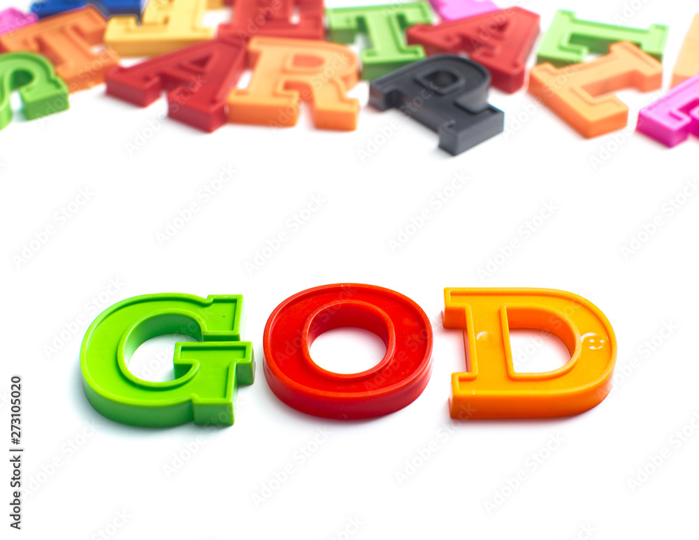Heap of plastic colored alphabet letters close up. God Heap of plastic colored alphabet letters close up. God