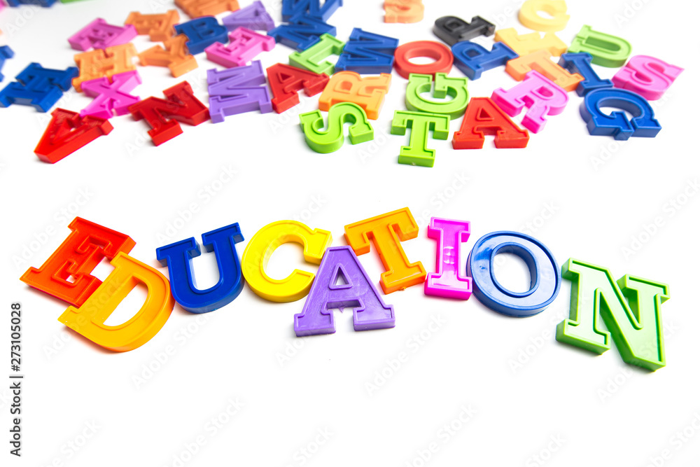Fototapeta premium Heap of plastic colored alphabet letters close up. Education