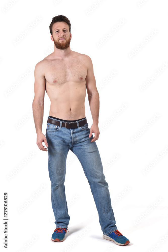 man shirtless and with blue jeans on white background