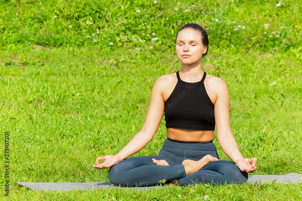 Woman on a yoga, relax in the park. Woman on a yoga, relax in the park.