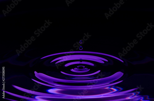 Water drop splash with purple colored