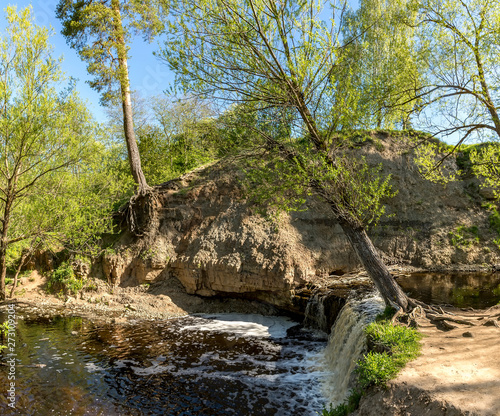 Waterfall on the river Sablinka in the village of Ulyanovsk, Leningrad region. photo