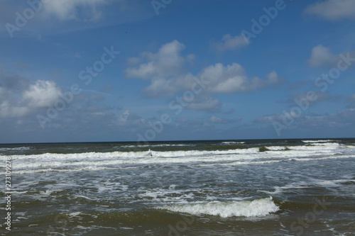 Dutch coast. Beach and dunes at Northsea Netherlands. Clouds.