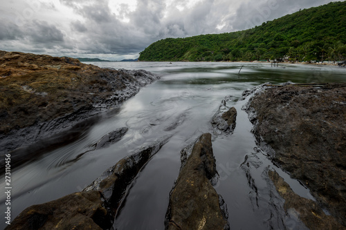 Oil sludge contaminating the sea during the oil spill disaster in Samet Island  Rayong  Thailand.