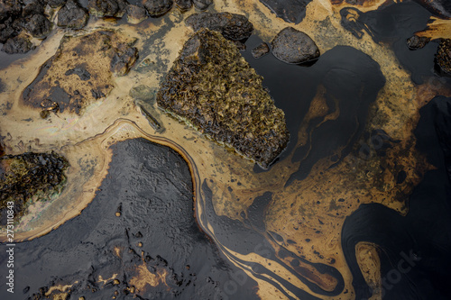Oil sludge contaminating the sea during the oil spill disaster in Samet Island, Rayong, Thailand.
