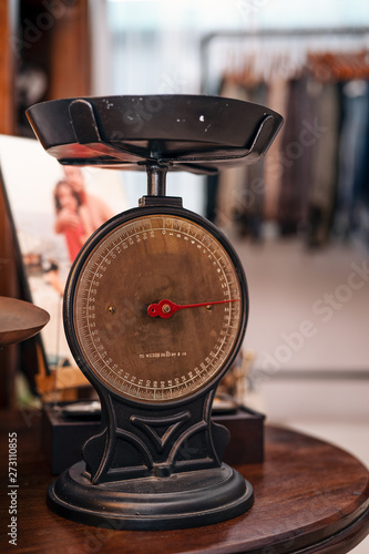 Many kind of old fashioned balance scales on wooden table. Colorful ancient balance scales in vintage background, isolated. the symbol of Lawyer. Royalty high quality free stock image.