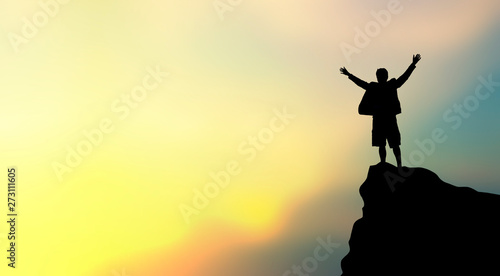 silhouette of man on mountain top over sky and sun light background,business, success, leadership, achievement and people concept