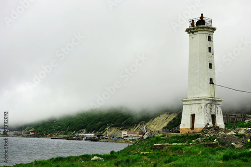 lighthouse on coast of sea