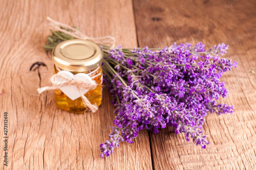 Lavander with aromatic oil on old wooden background Lavander with aromatic oil on old wooden background