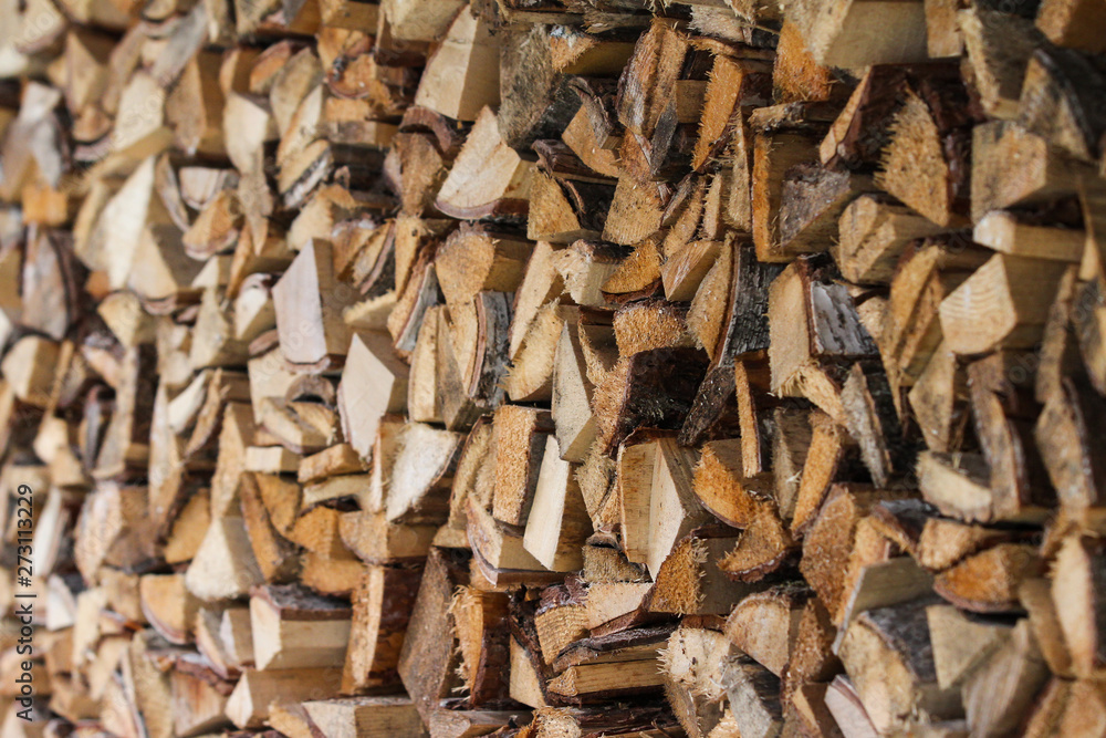 Beautiful countryside view of timber firewood stacked in a big stack near home in a countryside village home. Beautiful countryside view of timber firewood stacked in a big stack near home in a countryside village home.