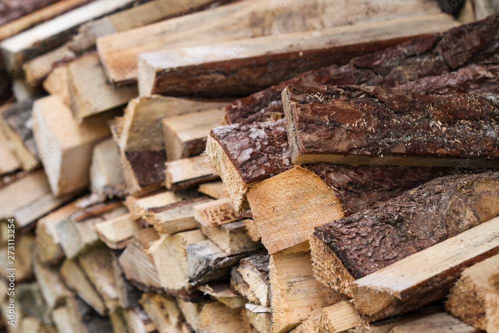 Beautiful countryside view of timber firewood stacked in a big stack near home in a countryside village home. Beautiful countryside view of timber firewood stacked in a big stack near home in a countryside village home.