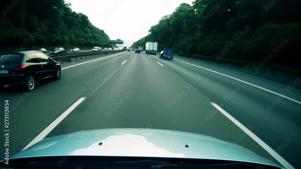 A highly stylized clip of a car speeding down the highway on the German autobahn. Highway dashcam deep blue grade. A highly stylized clip of a car speeding down the highway on the German autobahn. Highway dashcam deep blue grade.