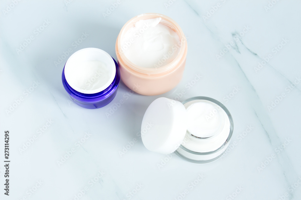 Set of different cosmetics cream. Blank label package for branding mock-up, Natural organic beauty product concept.Set of bowls with moisturizer cream. Set of different cosmetics cream. Blank label package for branding mock-up, Natural organic beauty product concept.Set of bowls with moisturizer cream.