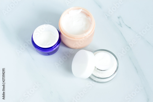 Set of different cosmetics cream. Blank label package for branding mock-up  Natural organic beauty product concept.Set of bowls with moisturizer cream. 
