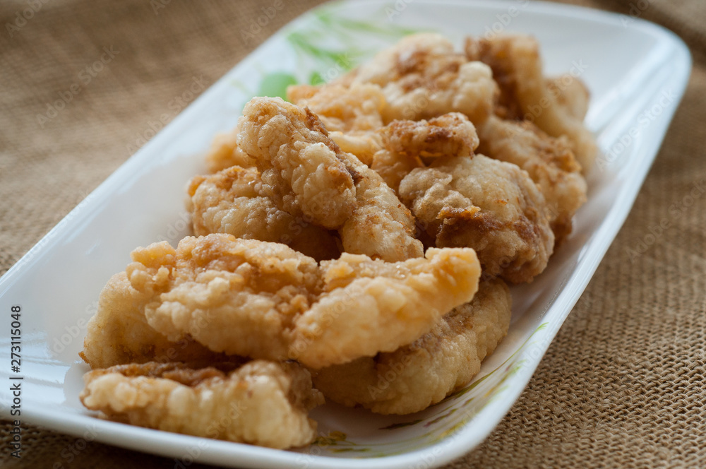 Malaysian style battered and deep fried dory fish cubes. Malaysian style battered and deep fried dory fish cubes.
