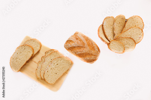 White bread and Sliced bread. Assortment of baked bread. Baked bread isolated on white background, top view. Bakery, food concept. Top view with space for your text.