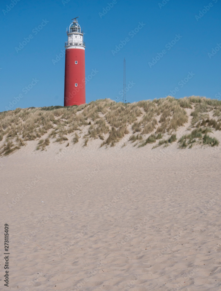 Dutch coast. Netherlands.. Dunes at Texel with lighthouse Northsea