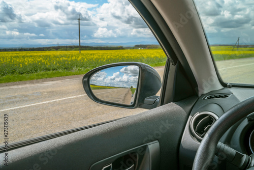 Car trip. Road view reflection on side mirror © FedBul