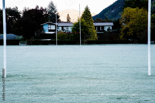 Icy rugby field and goalposts in cold weather morning at Arrowtown city, New Zealand. photo