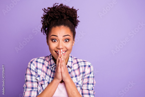 Close up photo of content funny funky millennial make religion gesture spiritual plead want wait expect inspired candid she wear plaid outfit top-knot isolated on purple background photo