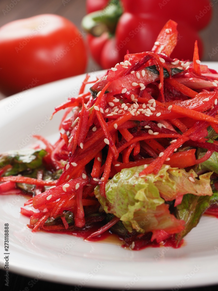 Salad of red and white cabbage and sweet red pepper, seasoned with olive oil Salad of red and white cabbage and sweet red pepper, seasoned with olive oil