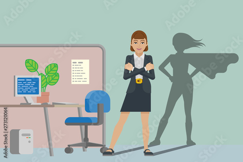 A business woman in her office revealed as super hero by her superhero silhouette shadow